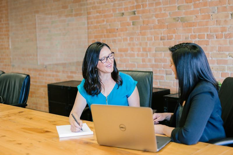 Account manager reviewing a customer acquisition plan with a client