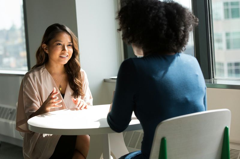 Nova Executives account manager in a face-to-face conversation with a client