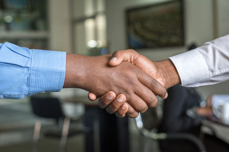 Handshake confirming a new client partnership after a consultation